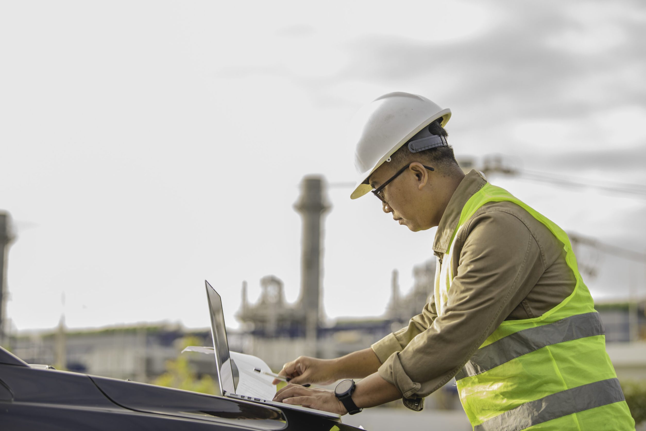 Asian man petrochemical engineer working at oil and gas refinery plant industry factory,The people worker man engineer work control at power plant energy industry manufacturing